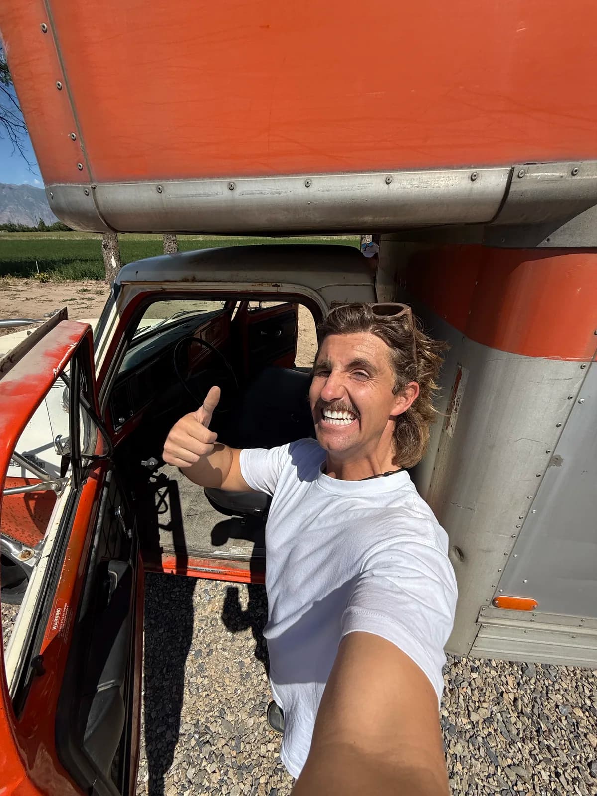 Matt working inside the original U-Haul cab during the conversion